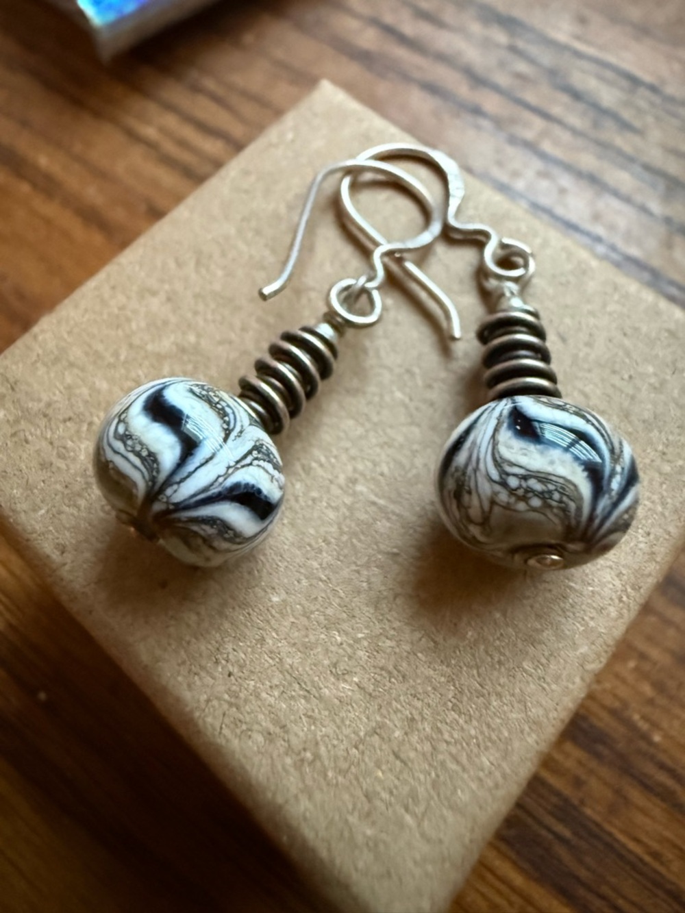 Handblown Glass Bead Earwires in a Black/brown (tan) swirl pattern.